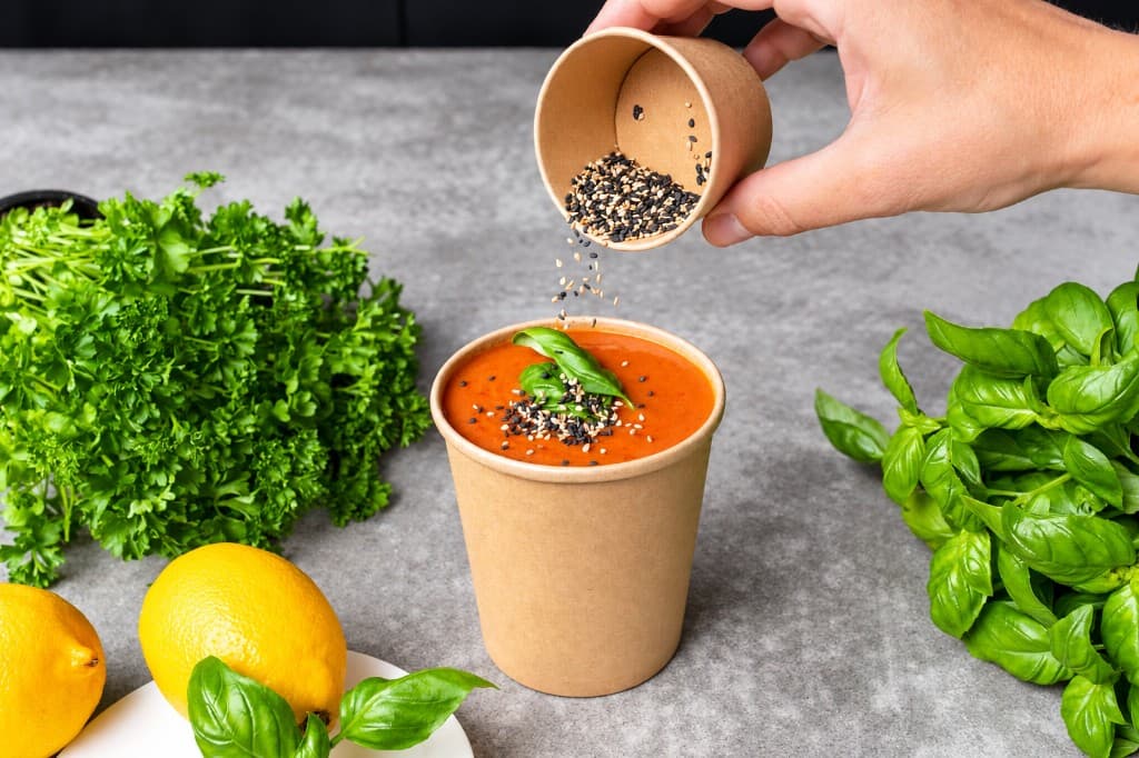 Two plated dishes served in renewable bowls