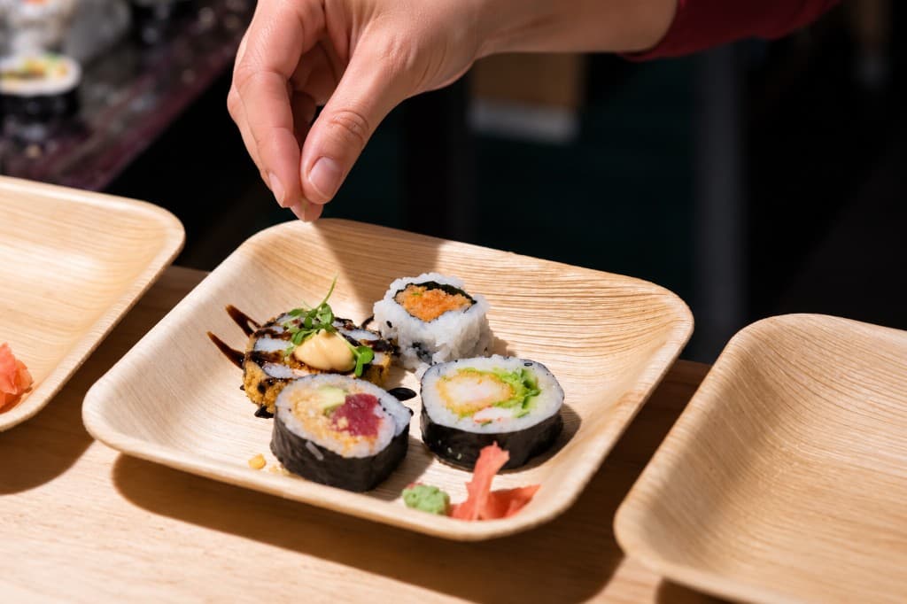 Sushi served on a palm-leaf plate