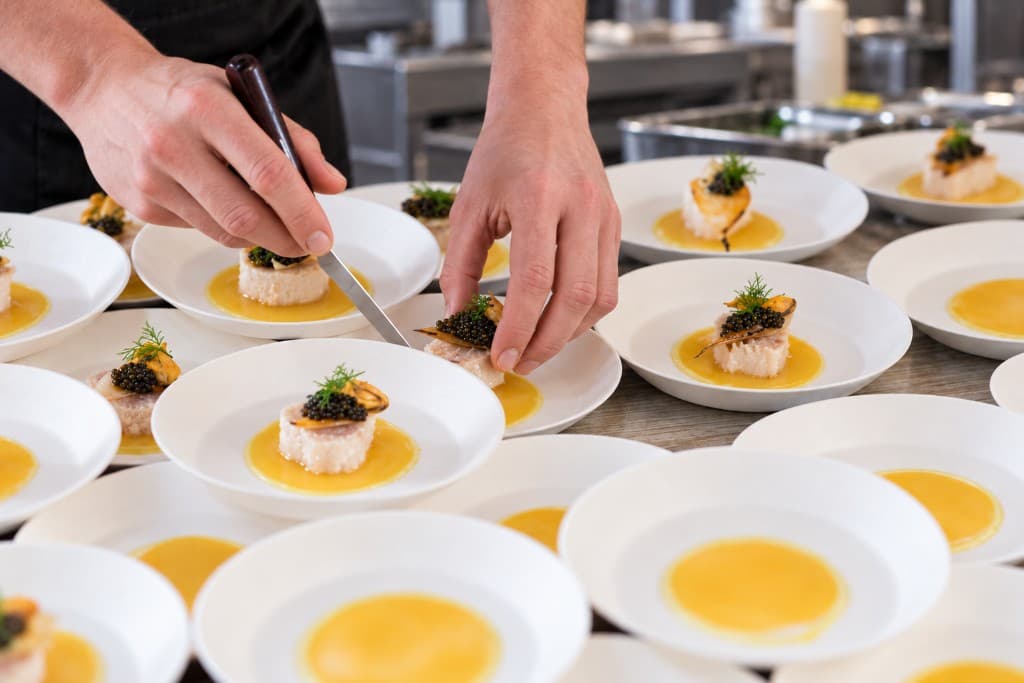 Culinary presentation of plated dishes in a professional kitchen